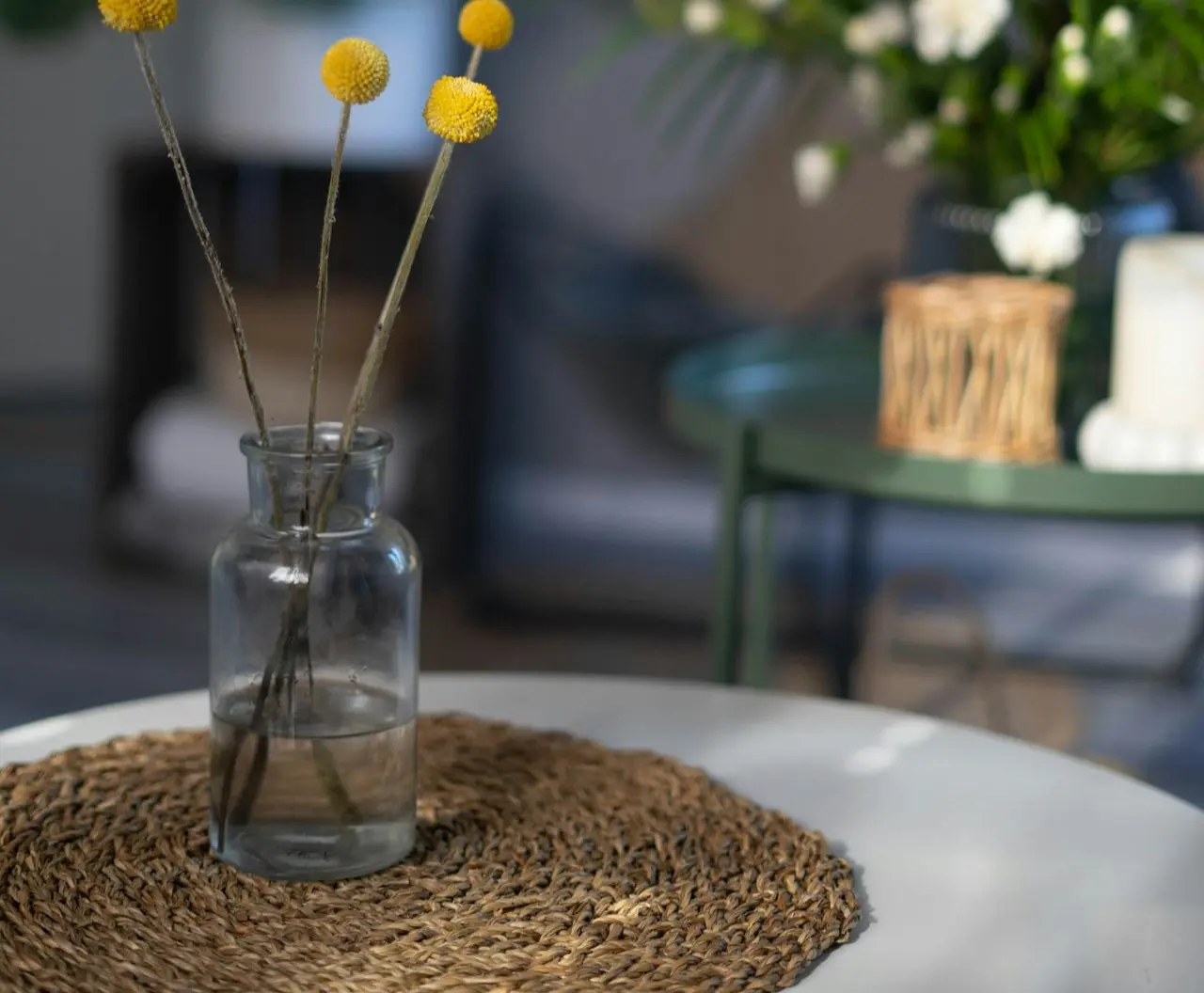 yellow and white flowers in clear glass vase
